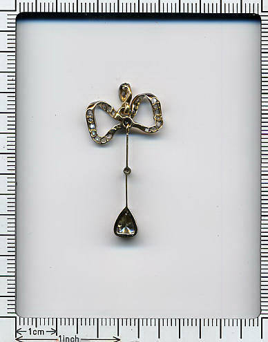 Victorian bow pendant with pear shape diamond